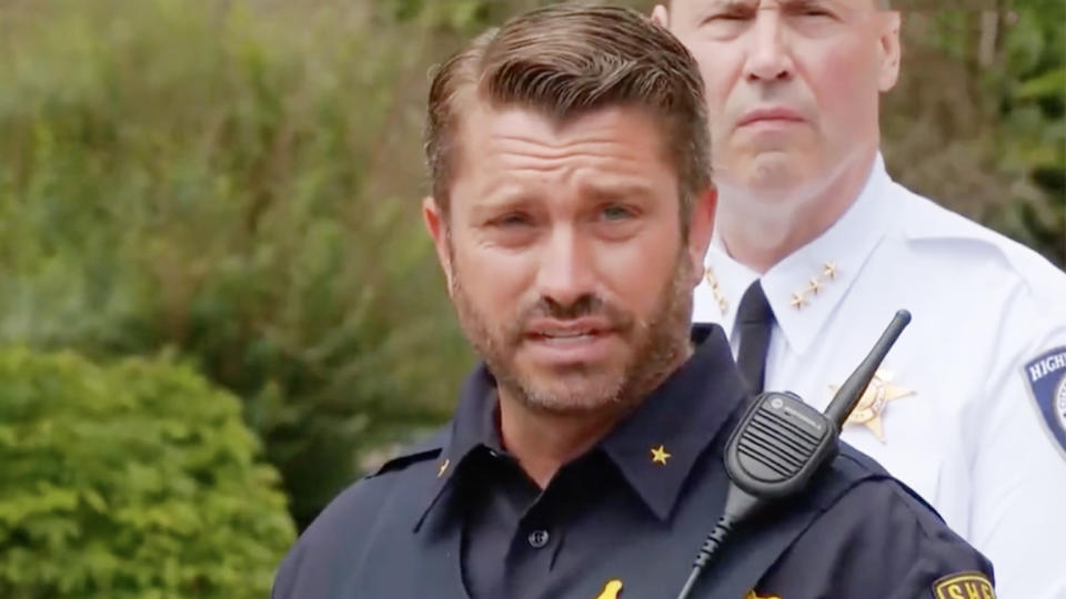 Chris Covelli, spokesperson for the Lake County Major Crime Task Force, with walkie-talkie pinned on his shoulder, speaks.