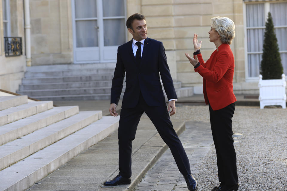 European Commission president Ursula van der Leyen gestures as she is welcomed by French President Emmanuel Macron before a working lunch, Monday, April 3, 2023 at the Elysee Palace in Paris. The two leaders will travel to China later this week. (AP Photo/Aurelien Morissard)