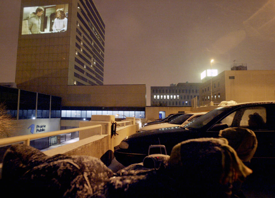 In this undated photo, Kristin Rudrud of Fargo, N.D., acts during a scene in the movie "Fargo" projected onto the downtown Radisson, in Fargo, N.D. When the movie Fargo debuted in 1996, many residents in the North Dakota city were not fans of the film’s dark humor, not to mention the heavy accents. But the fame and cash from the movie eventually brought many Fargo residents around. Now, 16 years later, Fargo awaits the debut of a new cable television show by the same name. And many residents are less apprehensive about how their hometown will be portrayed this time around. (AP Photo/The Forum, Darren Gibbins)