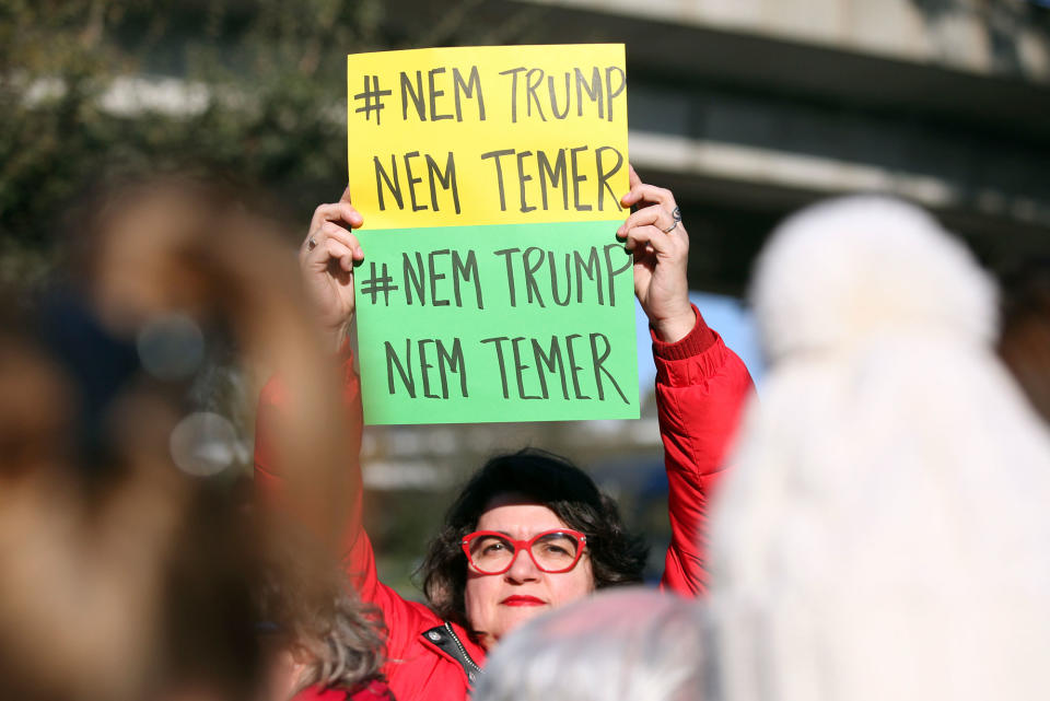 <p>A demonstrator holds a poster in the Brazilian colors reading ‘Neither Trump Nor Temer’, referring to the president of Brazil Michel Temer, during a Women’s March, Saturday, Jan. 21, 2017, in Lisbon. The march is part of a worldwide day of actions following the inauguration of U.S. President Donald Trump. (AP Photo/Armando Franca) </p>