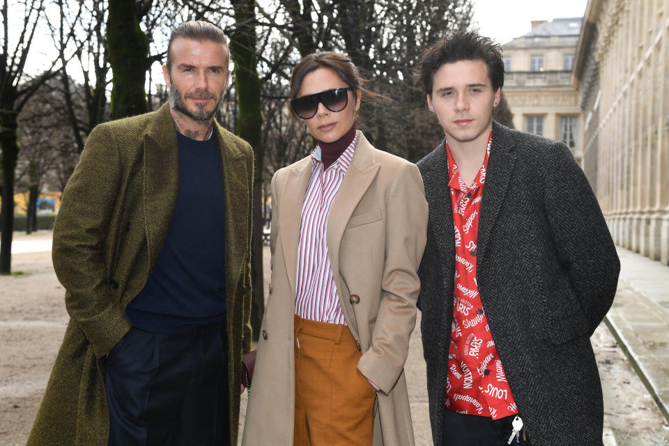 The 19-year-old pictured with his famous parents David and Victoria Beckham earlier this year. Photo: Getty