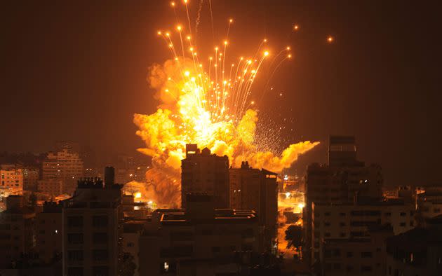 A missile explodes in Gaza City during an Israeli air strike on October 8, 2023.