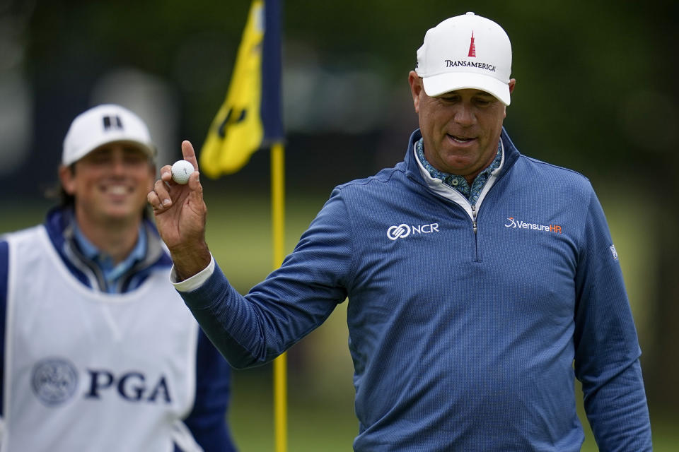 Stewart Cink waves after making a putt on the third hole during the third round of the PGA Championship golf tournament at Southern Hills Country Club, Saturday, May 21, 2022, in Tulsa, Okla. (AP Photo/Sue Ogrocki)