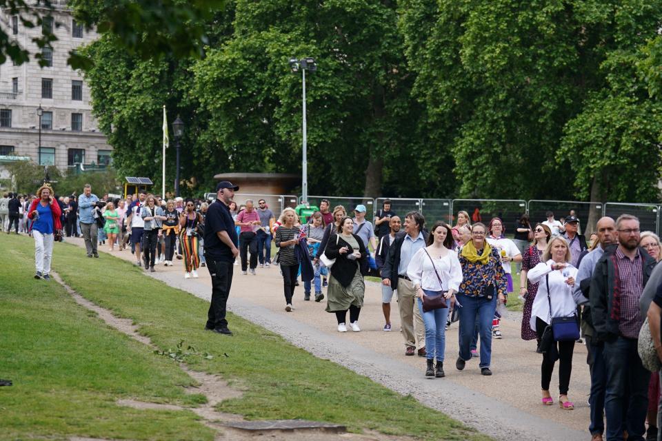 Ticket holders enter Green Park before the start of the Platinum Party at the Palace in front of Buckingham Palace (PA)