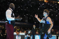 Osceola Magic's Mac McClung is greeted by Shaquille O'Neal during the slam dunk competition at the NBA basketball All-Star weekend, Saturday, Feb. 17, 2024, in Indianapolis. (AP Photo/Darron Cummings)