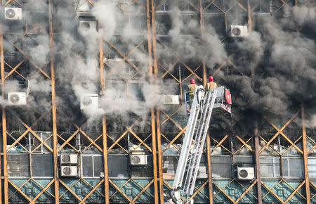 Firefighters try to put out fire in a blazing high-rise building in Tehran, Iran January 19, 2017. REUTERS/Foad Ashtari/Tasnim News Agency