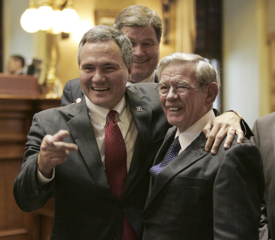 FILE - Speaker of the House Bobby Harrell R-Charleston, celebrates with Sen. Hugh Leatherman, R-Florence, after the announcement that the Boeing 787 plant was coming to South Carolina during a special session of the legislature Wednesday, Oct. 28, 2009, in Columbia, S.C. Looking on is Yancey McGill, D-Kingstree. Leatherman, South Carolina’s oldest and most powerful state lawmaker, died Friday, Nov. 12, 2021 at the age of 90. (AP Photo/Mary Ann Chastain, File)