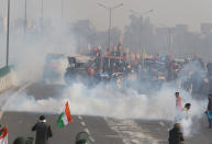 NOIDA, INDIA - JANUARY 26: Indian police use tear gas shell towards farmers during a rally as they continue their protest against the central government's recent agricultural reforms in Noida, India on January 26, 2021. (Photo by Pankaj Nangia/Anadolu Agency via Getty Images)