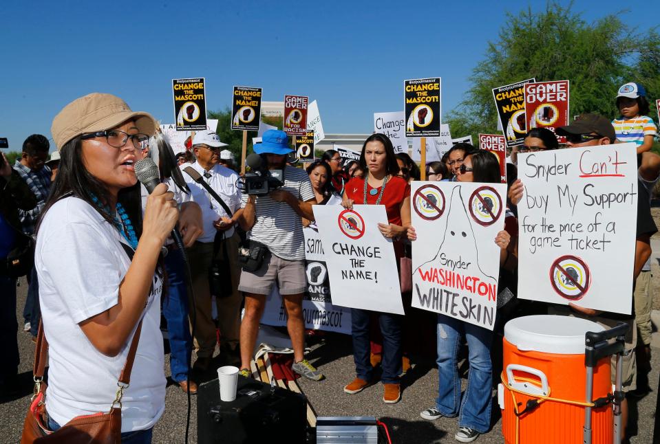 Amanda Blackhorse, a Navajo activist, leads a protests against the team now known as the Washington Commanders Sunday, Oct. 12, 2014 outside the University of Phoenix Stadium in Glendale, Ariz.