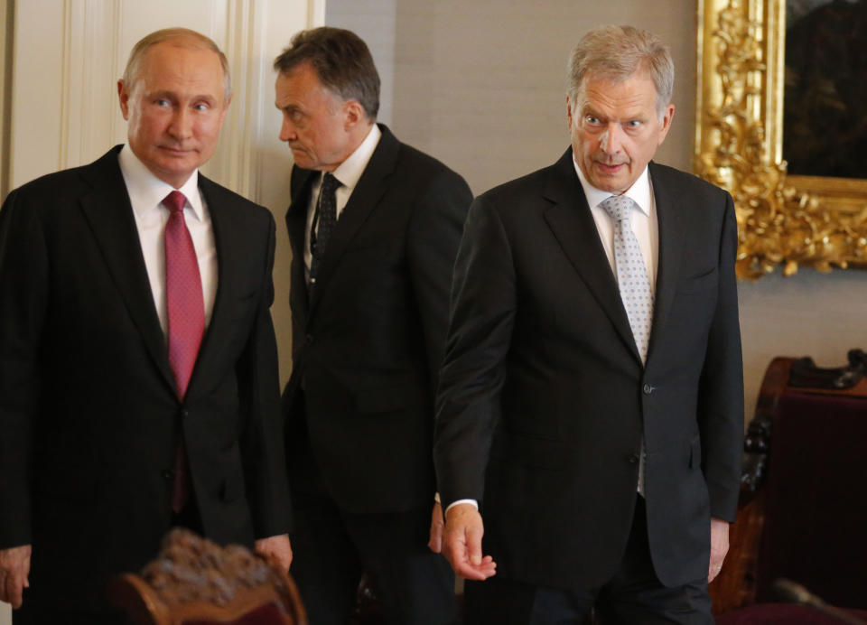 President of the Republic of Finland Sauli Niinisto, right, and Russian President Vladimir Putin walk during their meeting at the President's official residence Mantyniemi in Helsinki, Finland, Wednesday, Aug. 21, 2019. (AP Photo/Alexander Zemlianichenko, Pool)