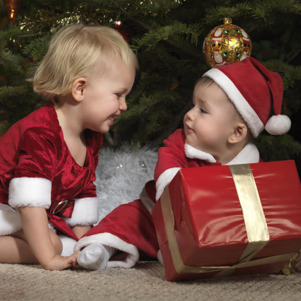 <b>Top 10 cute baby Christmas outfits </b><br><br>Don't these two look adorable in their his and hers Santa outfits?<br><br>© Rex