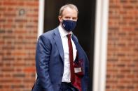 Britain's Foreign Affairs Secretary Dominic Raab walks outside Downing Street in London