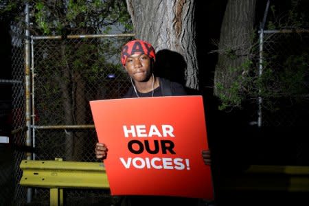 FILE PHOTO: A student from Gary Comer College Prep school poses for a portrait after Pastor John Hannah of New Life Covenant Church lead a march and pray for our lives against gun violence in Chicago, Illinois, U.S., May 19, 2018. REUTERS/Joshua Lott