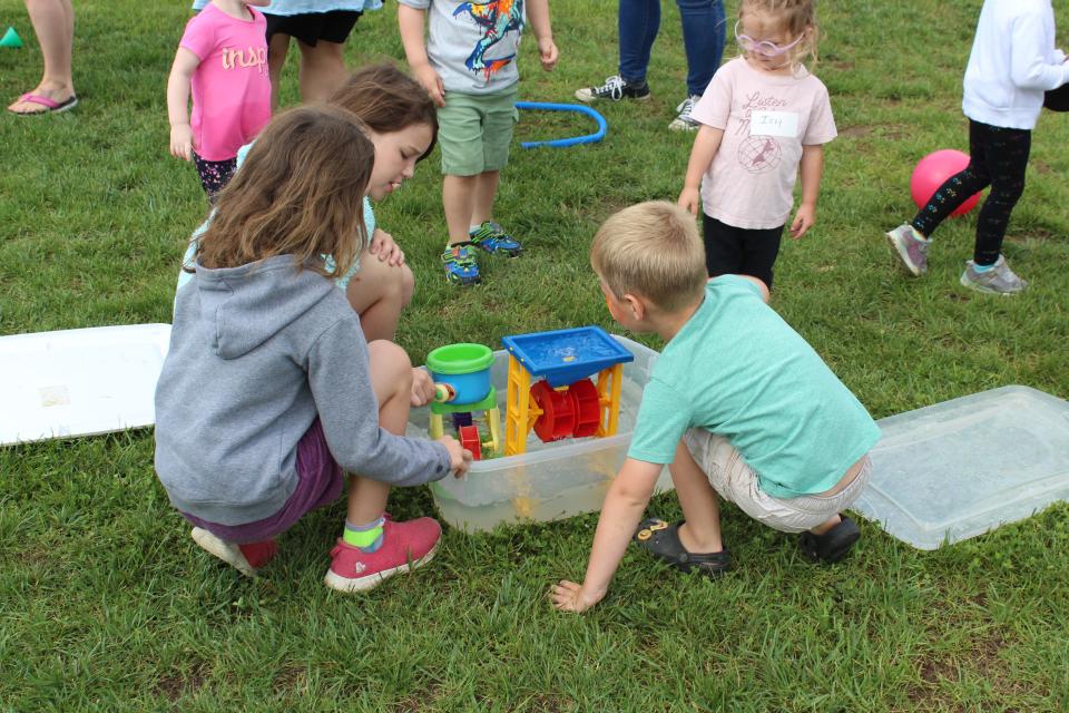 Community members gather to officially welcome "The Bee" mobile library to Ross County.