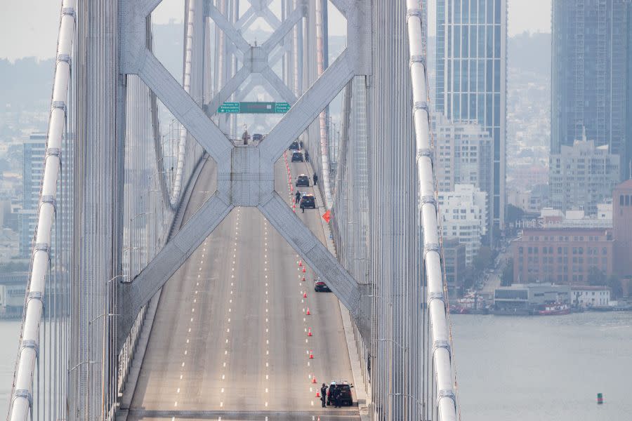 Empty westbound lanes on the western span of the Bay Bridge are seen as police respond to protestors. (Photo by JASON HENRY/AFP via Getty Images)