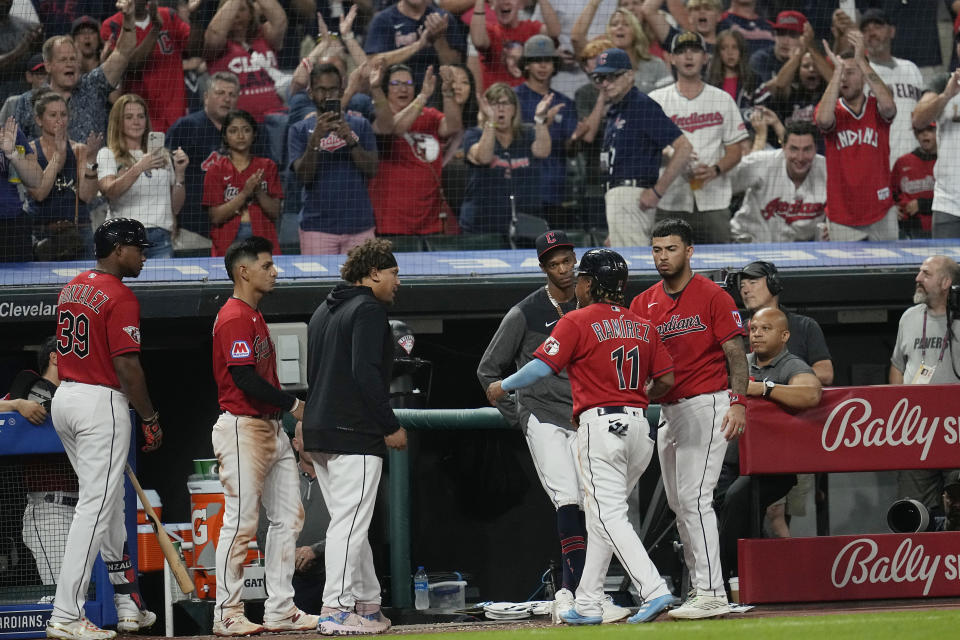 Cleveland Guardians' Jose Ramirez (11) is cheered as he walks off the field following an altercation with Chicago White Sox's Tim Anderson in the sixth inning of a baseball game Saturday, Aug. 5, 2023, in Cleveland. (AP Photo/Sue Ogrocki)