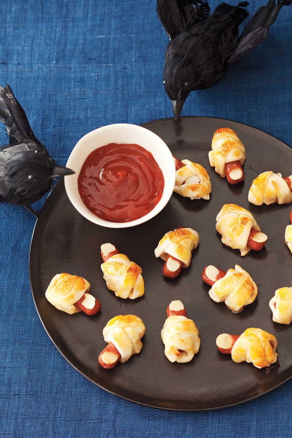 <p>For a comically grotesque appetizer, fashion your mini hotdogs into these bandaged toes — then, watch a good horror movie. </p><p>Get the <a href="https://www.womansday.com/food-recipes/food-drinks/recipes/a11471/severed-toes-in-bandages-recipe-122709/" rel="nofollow noopener" target="_blank" data-ylk="slk:Severed Toes in Bandages recipe;elm:context_link;itc:0;sec:content-canvas" class="link "><strong>Severed Toes in Bandages recipe</strong></a> from Woman's Day. </p><p><strong>RELATED: </strong><a href="https://www.goodhousekeeping.com/life/entertainment/g28067867/best-horror-movies-on-netflix/" rel="nofollow noopener" target="_blank" data-ylk="slk:The Best Netflix Horror Movies That Will Make You Keep the Lights on All Night;elm:context_link;itc:0;sec:content-canvas" class="link ">The Best Netflix Horror Movies That Will Make You Keep the Lights on All Night</a><br></p>