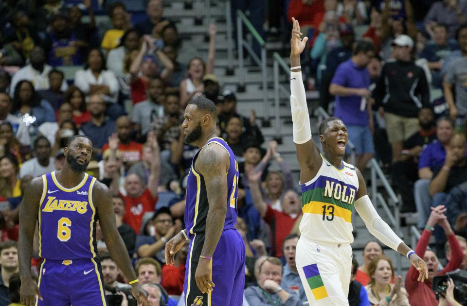 Even without Anthony Davis in the lineup, the Pelicans had no problem rolling over LeBron James and the Lakers on Saturday night. (AP Photo/Matthew Hinton)