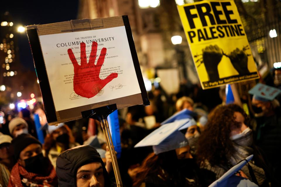People march as they gather to protest the banning of Students for Justice in Palestine and Jewish Voice for Peace at Columbia University on Nov. 20 in New York City.