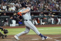 Detroit Tigers' Colt Keith connects for a run-scoring single against the Arizona Diamondbacks during the third inning of a baseball game Friday, May 17, 2024, in Phoenix. (AP Photo/Ross D. Franklin)