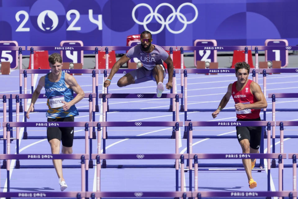 Freddie Crittenden, of the United States, competes in a men's 110 meters hurdles round 1 heat at the 2024 Summer Olympics, Sunday, Aug. 4, 2024, in Saint-Denis, France. (AP Photo/Martin Meissner)