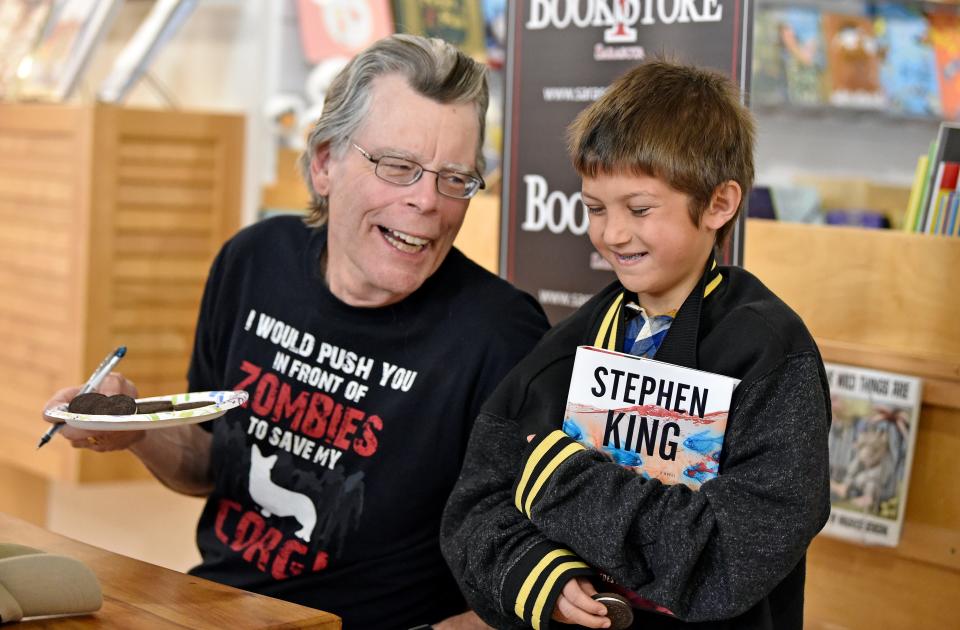 Stephen King, who has a Sarasota County home on Casey Key,  shares his Oreo cookies with Dallis Bernabi, 10, of North Port, during King's visit to Bookstore1Sarasota for a sold-out book signing March 15, 2017, on Palm Avenue in downtown Sarasota.