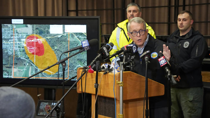 Ohio Governor Mike DeWine meets with reporters after touring the Norfolk and Southern train derailment site in East Palestine, Ohio, Monday, Feb. 6, 2023. Authorities in Ohio say they plan to release toxic chemicals from five cars of a derailed train in Ohio to reduce the threat of an explosion. Gov. DeWine says a “controlled release” of vinyl chloride will take place on Monday at 3:30 p.m. (AP Photo/Gene J. Puskar)