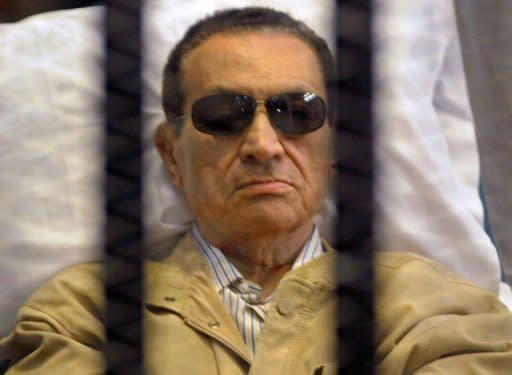 Ousted Egyptian president Hosni Mubarak sits inside a cage in a courtroom during his verdict hearing in Cairo on June 2. Mubarak, now serving a life sentence in a Cairo prison over the killing or protesters, said the authorities "want to kill" him in jail