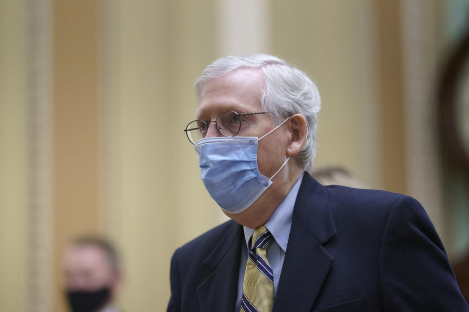 Senate Minority Leader Mitch McConnell, R-Ky., returns to the chamber as the Senate voted to consider hearing from witnesses in the impeachment trial of former President Donald Trump, at the Capitol in Washington, Saturday, Feb. 13, 2021. (AP Photo/J. Scott Applewhite)