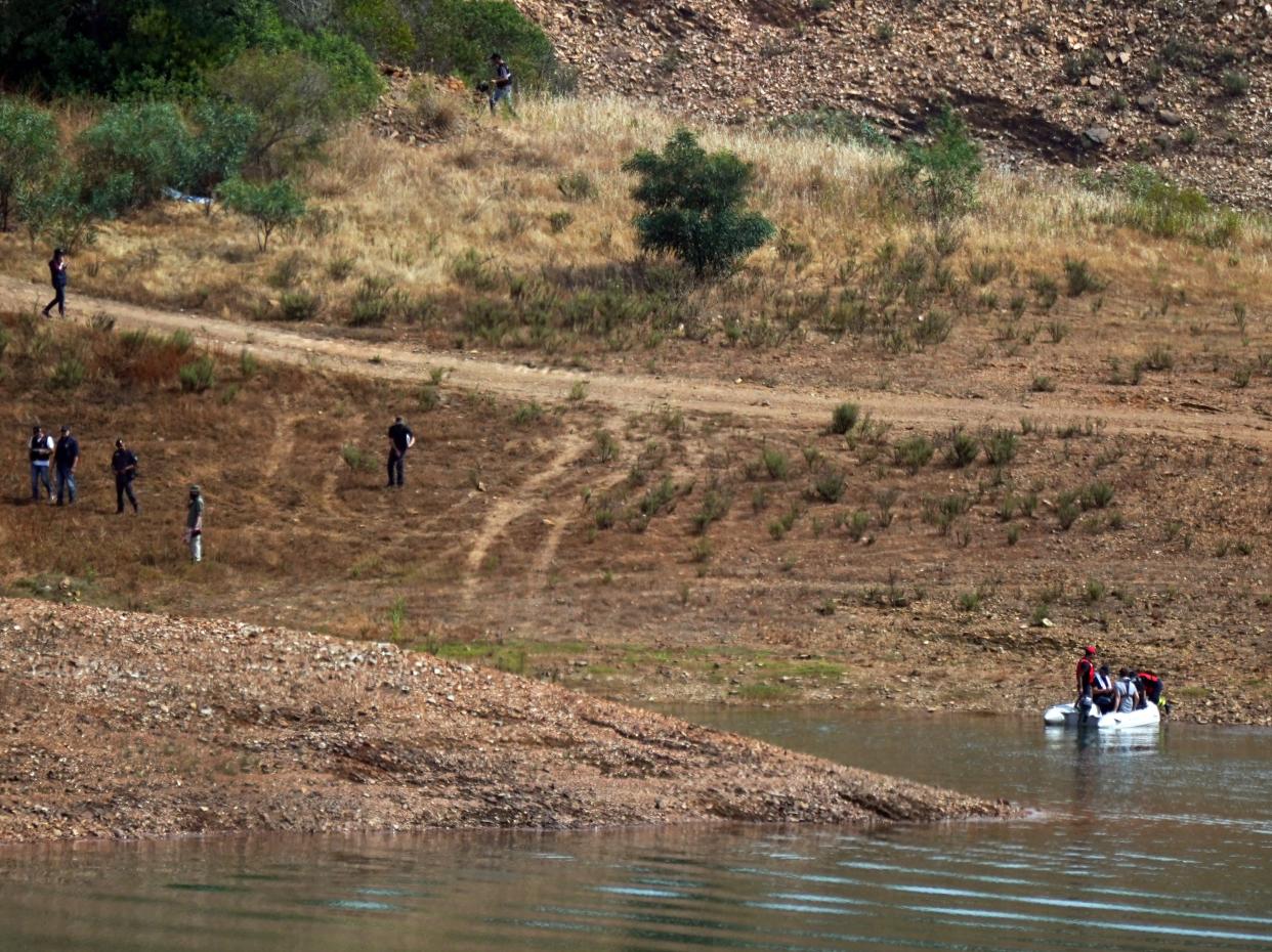 Personnel at Barragem do Arade reservoir, in the Algave, Portugal, as searches begin as part of the investigation into the disappearance of Madeleine McCann. The area is around 50km from Praia da Luz where Madeleine went missing in 2007. Picture date: Tuesday May 23, 2023. (Photo by Yui Mok/PA Images via Getty Images)