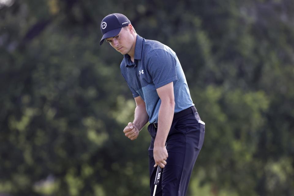 Jordan Spieth pumps his fist after his birdie putt on the 18th green during the third round of the Charles Schwab Challenge golf tournament at Colonial Country Club in Fort Worth, Texas, Saturday, May 29, 2021. (AP Photo/Ron Jenkins)