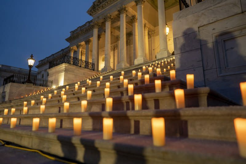 The U.S. Capitol is seen during a candlelight vigil where speaker of the House Nancy Pelosi, D-CA, Senate Majority Leader Chuck Schumer, D-NY, U.S. House Majority Leader Steny Hoyer D-MD and other democrats attended on the one year anniversary of the Jan. 6 riot at the U.S. Capitol in Washington, DC on Thursday, January 6, 2022. Photo by Ken Cedeno/UPI