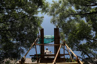 <p>A worker waits for bricks and other construction materials to be delivered on the Jiankou section of the Great Wall, located in Huairou District, north of Beijing, China, June 7, 2017. (Photo: Damir Sagolj/Reuters) </p>