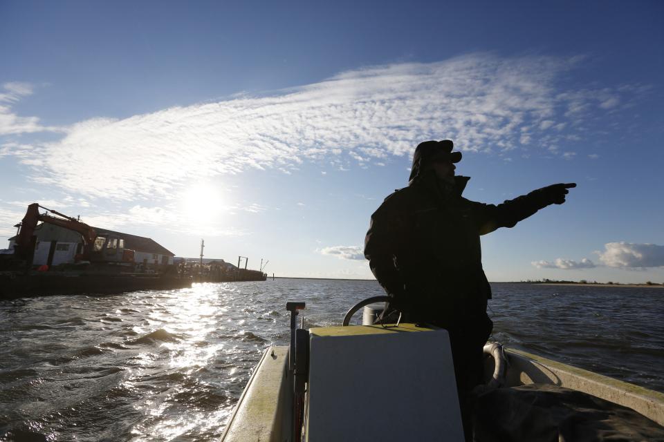 Saxis Island resident and duck decoy carver Grayson Chesser takes to the water off this historic fishing village on Virginia's Eastern Shore