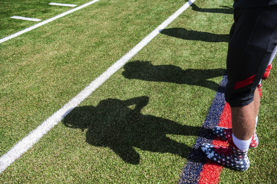 Aspen High School football players watch the varsity game against Bayfield High School from the sidelines on Saturday, September 7, 2019. (Kelsey Brunner/The Aspen Times via AP)