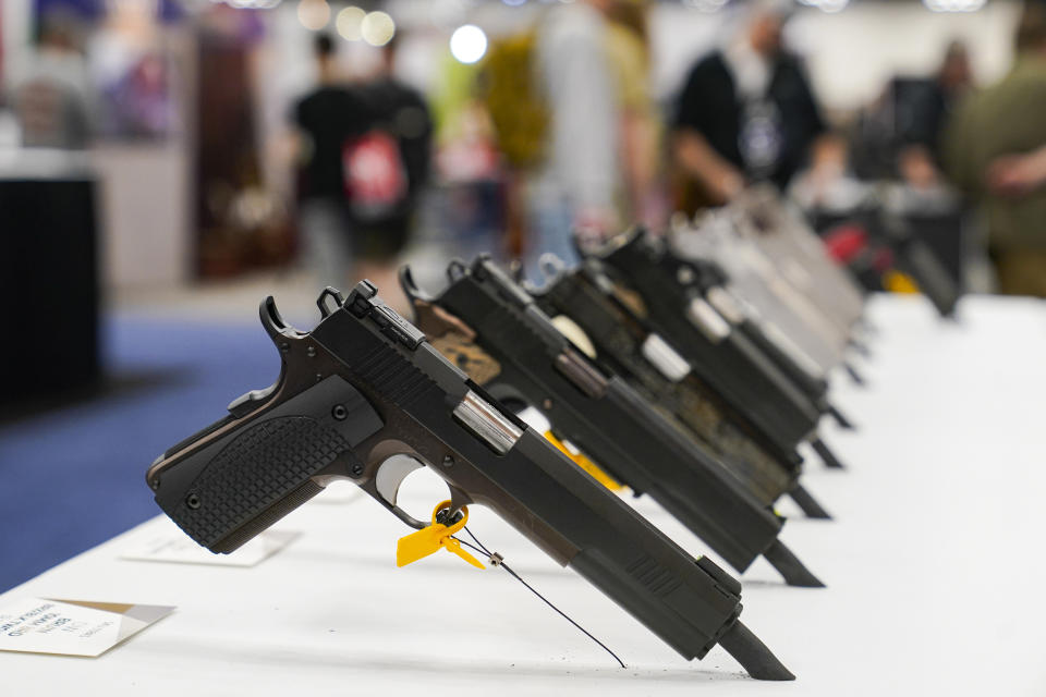 FILE - An array of pistols are shown in the Dan Wesson display as guests browse firearms at the National Rifle Association's Annual Meetings & Exhibits in Indianapolis, April 16, 2023. The roster of Republican presidential hopefuls who flocked to the National Rifle Association's annual convention reflects the political potency of gun rights, despite the group's eroding revenues and an opposition movement that's growing increasingly vocal as the drumbeat of mass shootings marches on.(AP Photo/Michael Conroy, File)