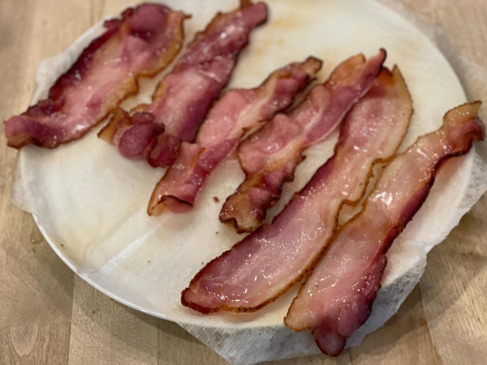 crispy curly bacon on a plate