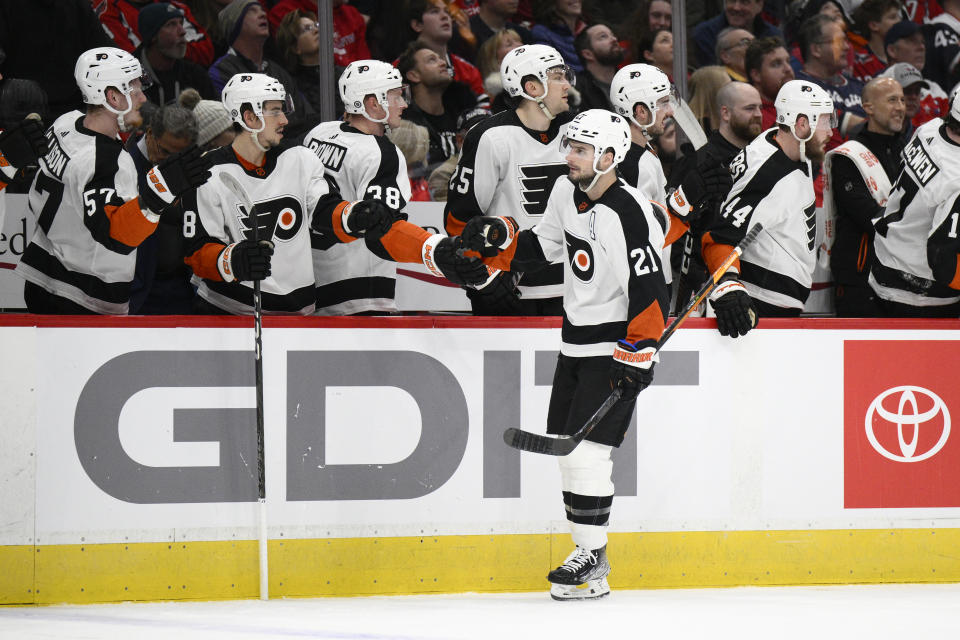 Philadelphia Flyers center Scott Laughton (21) celebrates his goal against the Washington Capitals during the first period of an NHL hockey game Saturday, Jan. 14, 2023, in Washington. (AP Photo/Nick Wass)