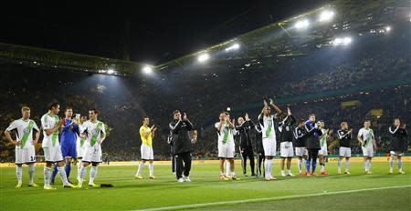 VfL Wolfsburg's players react after the German soccer cup (DFB Pokal) semi-final match against Borussia Dortmund in Dortmund April 15, 2014. Dortmund won the match 2-0. REUTERS/Kai Pfaffenbach