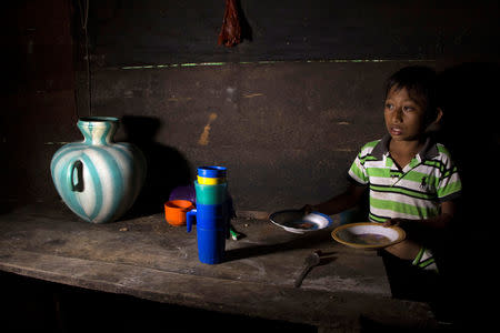 Abdel Caal, brother of Jakelin, a 7-year-old girl who died in U.S. custody, stands inside his house in Raxruha, Guatemala December 15, 2018. REUTERS/Josue Decavele