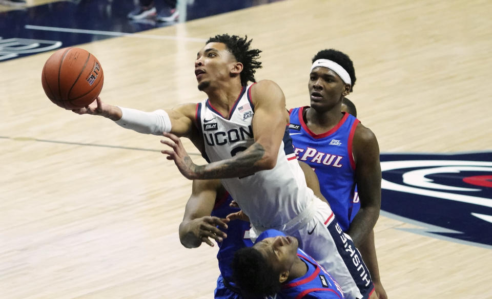 FILE - In this Dec. 30, 2020, file photo, Connecticut guard James Bouknight (2) shoots against DePaul during the first half of an NCAA college basketball game in Storrs, Conn. (David Butler II/Pool Photo via AP, File)