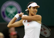 LONDON, ENGLAND - JULY 02: Ana Ivanovic of Serbia returns the ball during her Ladies' singles fourth round match against Victoria Azarenka of Belarus on day seven of the Wimbledon Lawn Tennis Championships at the All England Lawn Tennis and Croquet Club on July 2, 2012 in London, England. (Photo by Clive Rose/Getty Images)