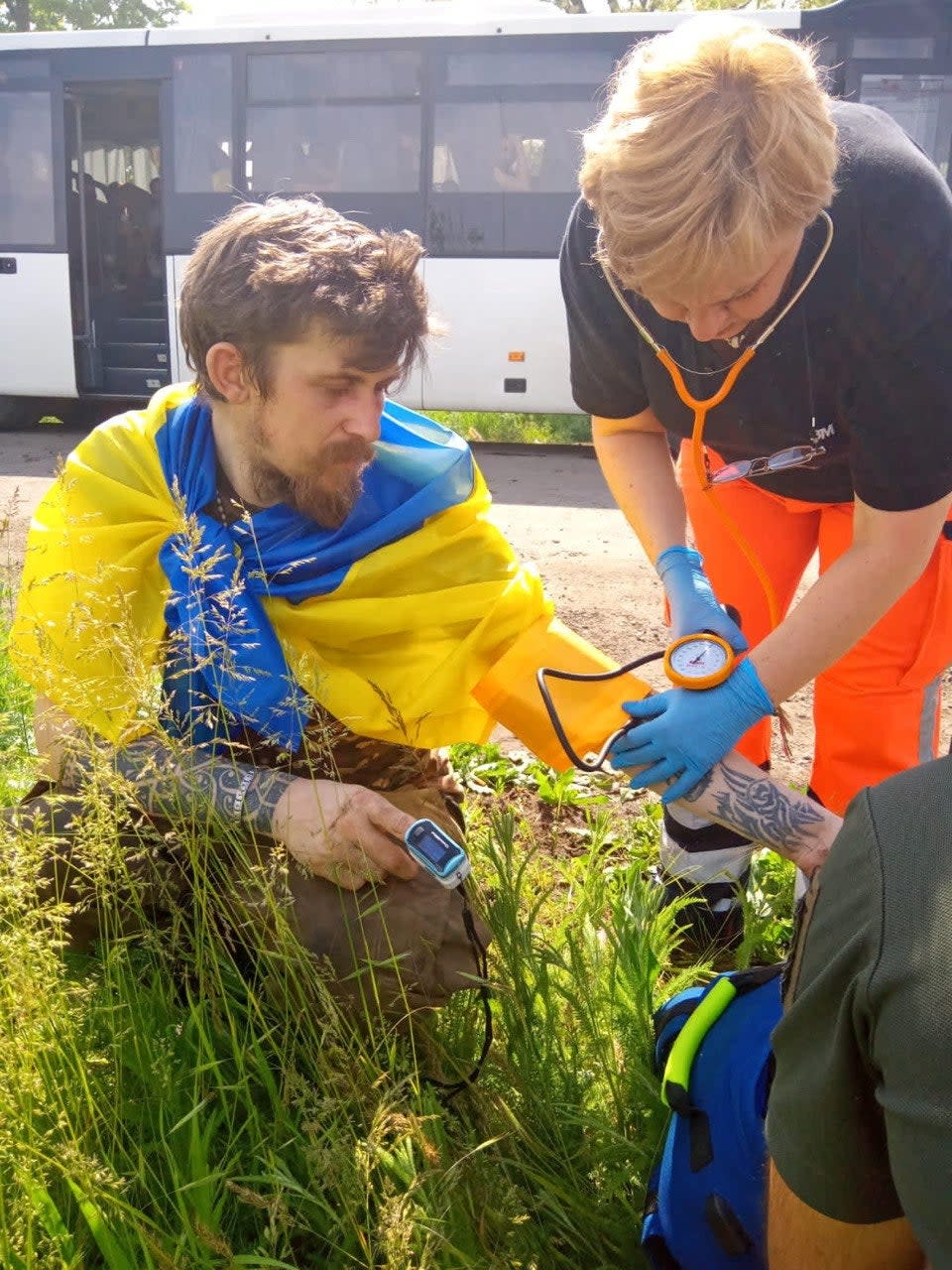 A Ukrainian prisoner of war (POW) receives a medical aid after a swap, amid Russia's attack on Ukraine (via REUTERS)