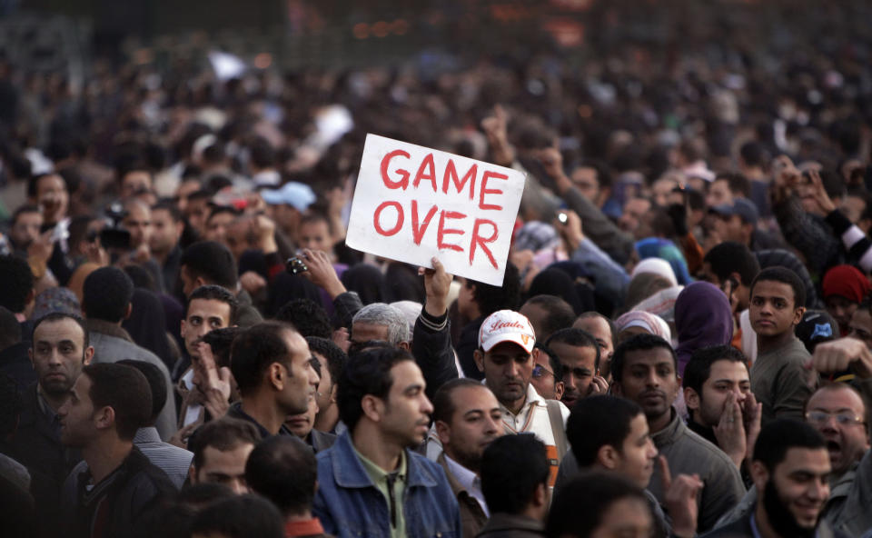 FILE - In this Jan. 29, 2011 file photo, anti-government protesters gather in Tahrir Square, Cairo, Egypt. Ten years ago, an uprising in Tunisia opened the way for a wave of popular revolts against authoritarian rulers across the Middle East known as the Arab Spring. For a brief window as leaders fell, it seemed the move toward greater democracy was irreversible. Instead, the region saw its most destructive decade of the modern era. Syria, Yemen, Libya and Iraq have been torn apart by wars, displacement and humanitarian crisis. (AP Photo/Ben Curtis, File)