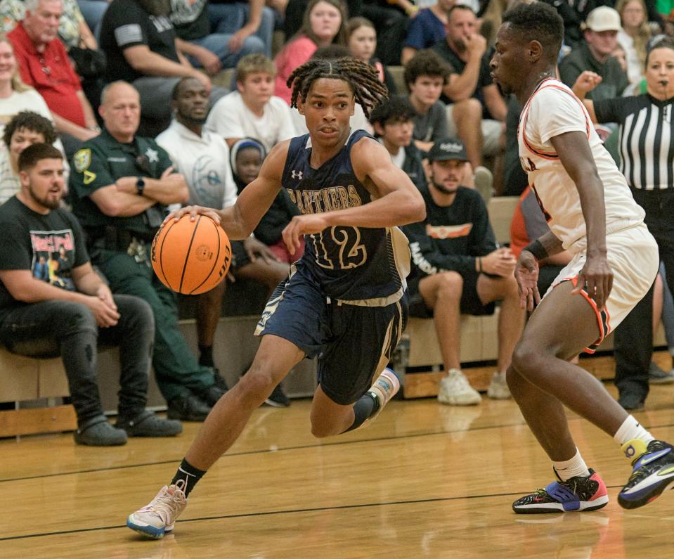 Eustis’ Lomar Sparrow (12) drives the basket during Thursday's game against Umatilla in Umatilla.