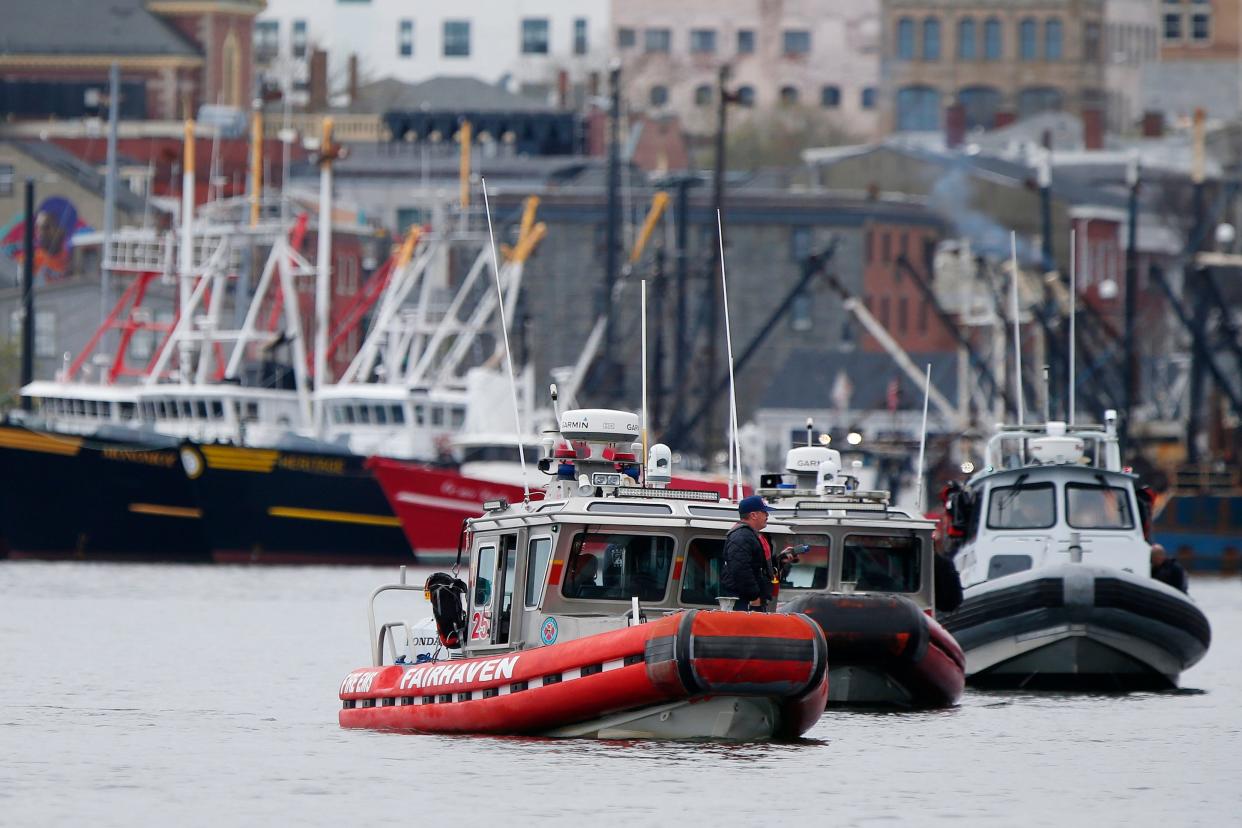 A Fairhaven firefighter is seen holding a handheld radiation isotope identification device during an exercise conducted in New Bedford harbor using new maritime radiation detection equipment.