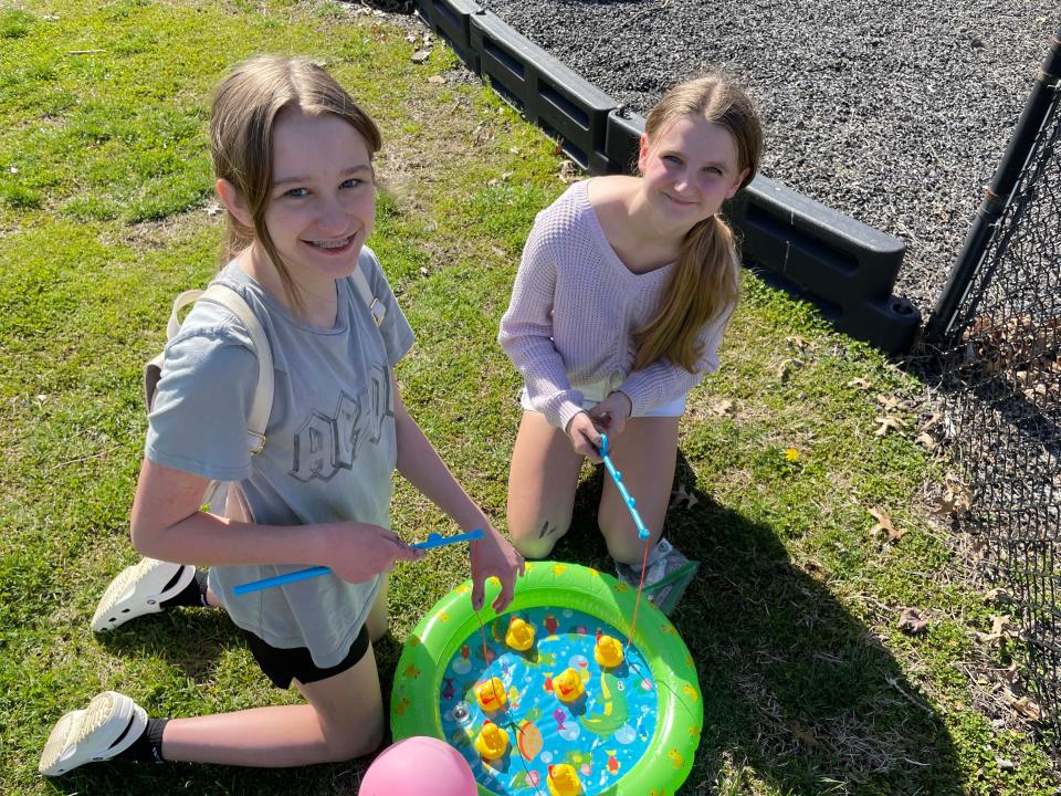 Alex Searcy, 12, and Alyana Davidson, 12, play a fishing game at the annual Spring Fling at Beaver Ridge United Methodist Church March 26, 2023.