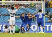 Greece's Sokratis Papastathopoulos (19) celebrates after scoring a goal during their 2014 World Cup round of 16 game against Costa Rica at the Pernambuco arena in Recife June 29, 2014. REUTERS/Yves Herman