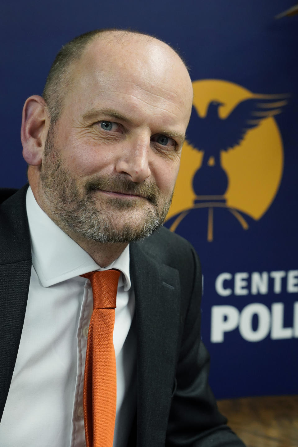 Douglas Carswell, a former member of Parliament in Britain for 12 years, and new President and CEO of The Mississippi Center for Public Policy, is photographed before the logo of the free-market, conservative think tank based in Jackson, Miss., Thursday, Jan. 6, 2021. (AP Photo/Rogelio V. Solis)