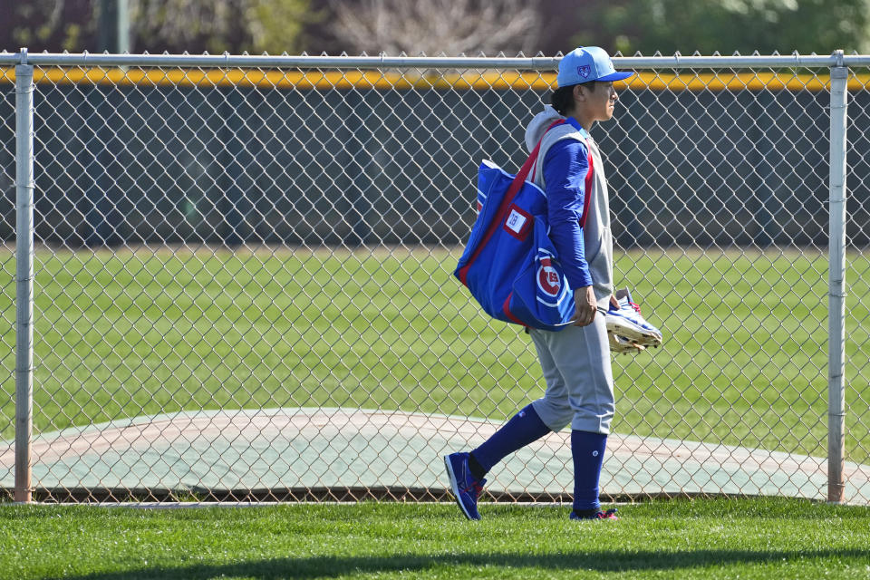 Chicago Cubs pitcher Shota Imanaga walks to the clubhouse after a MLB baseball spring training workout, Wednesday, Feb. 14, 2024, in Mesa, Ariz. (AP Photo/Matt York)